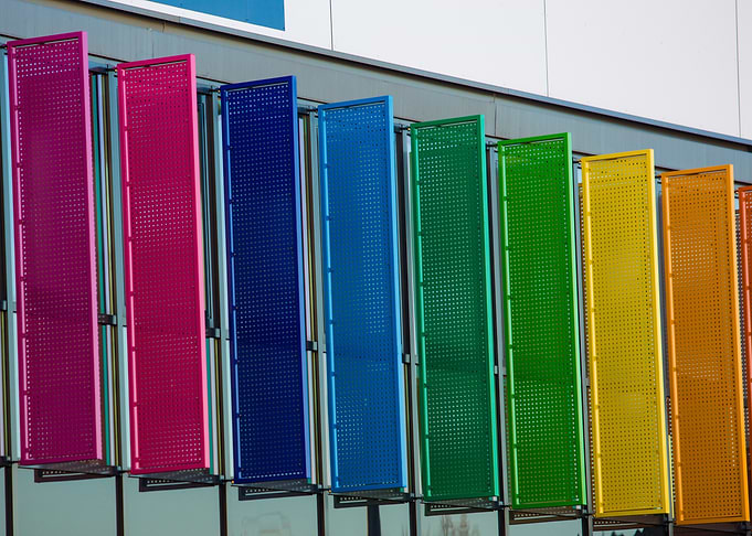 Colorful perforated panels on a building
