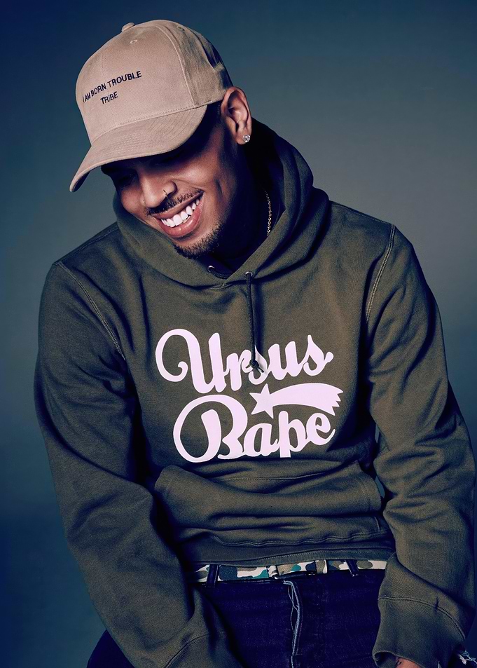 Chris Brown wearing a hoodie and cap