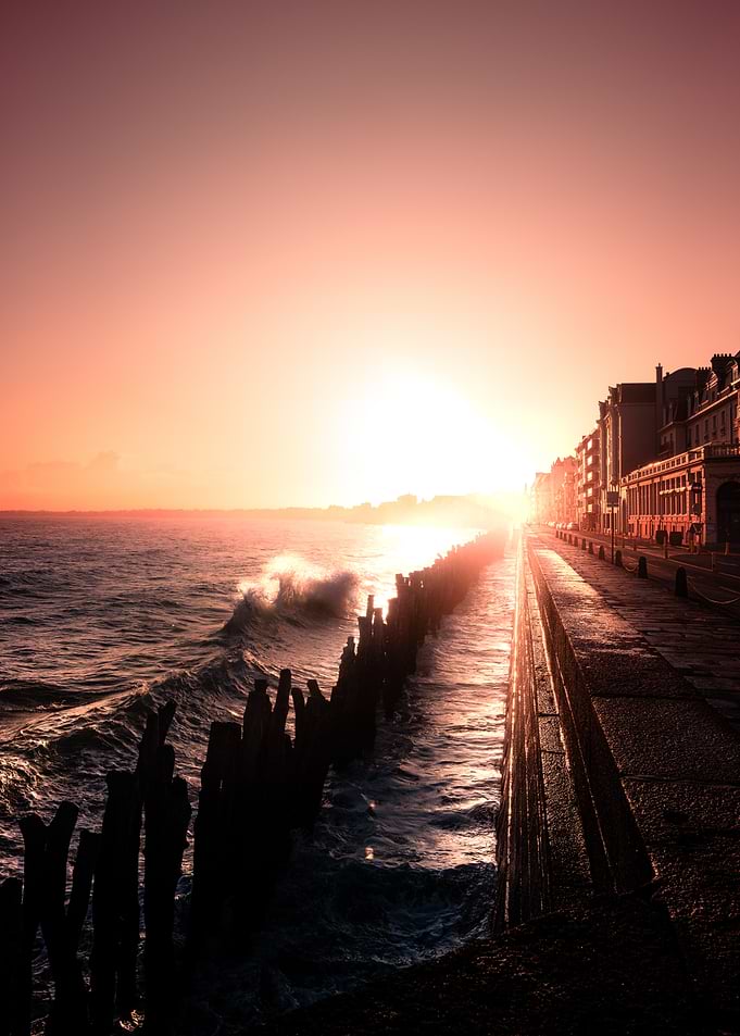 Sunset Over Coastal City Boardwalk
