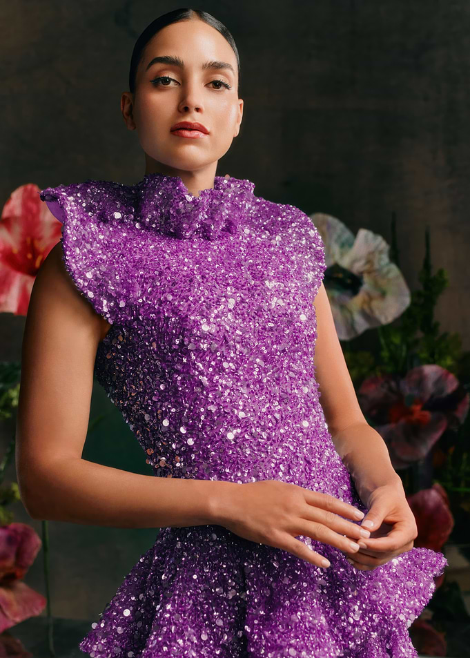 melissa barrera in a sequined purple dress