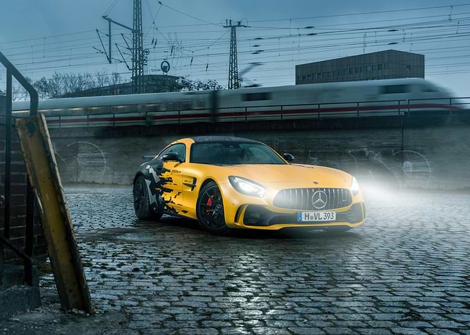 Yellow Mercedes-AMG GT R on Cobblestone Street