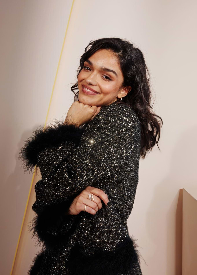 rachel zegler in sparkly coat with feather trim