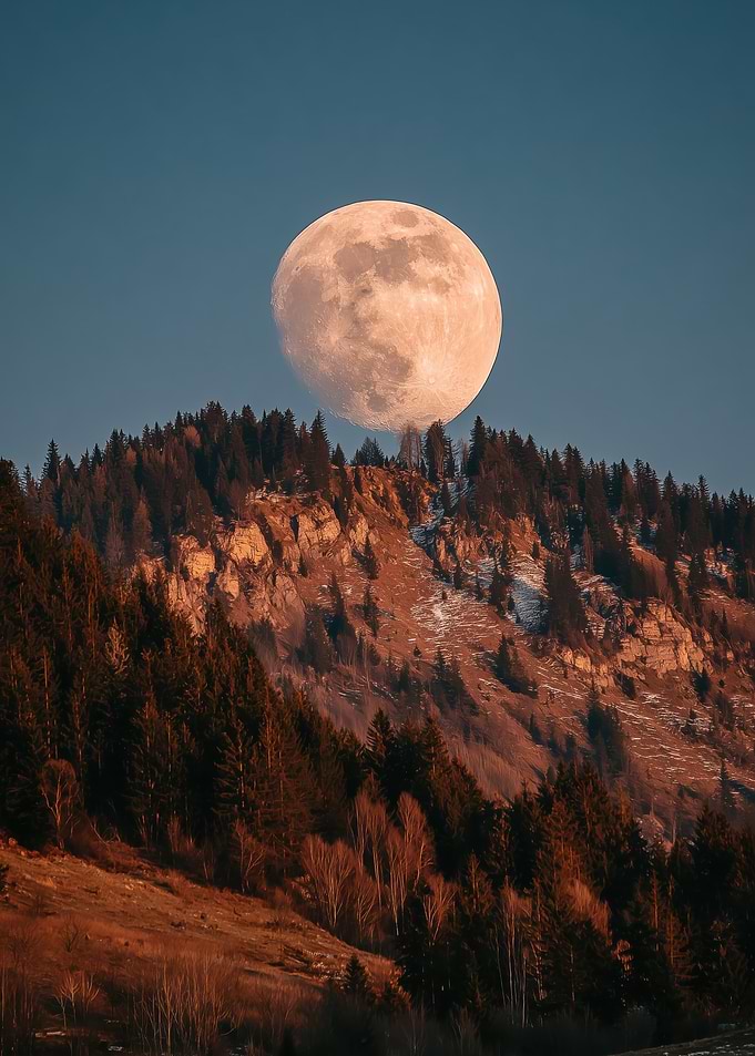 Full Moon Over Forested Mountains