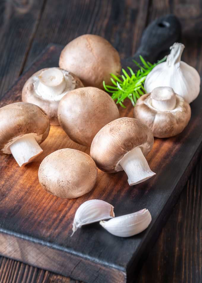 Mushrooms and Garlic on Cutting Board