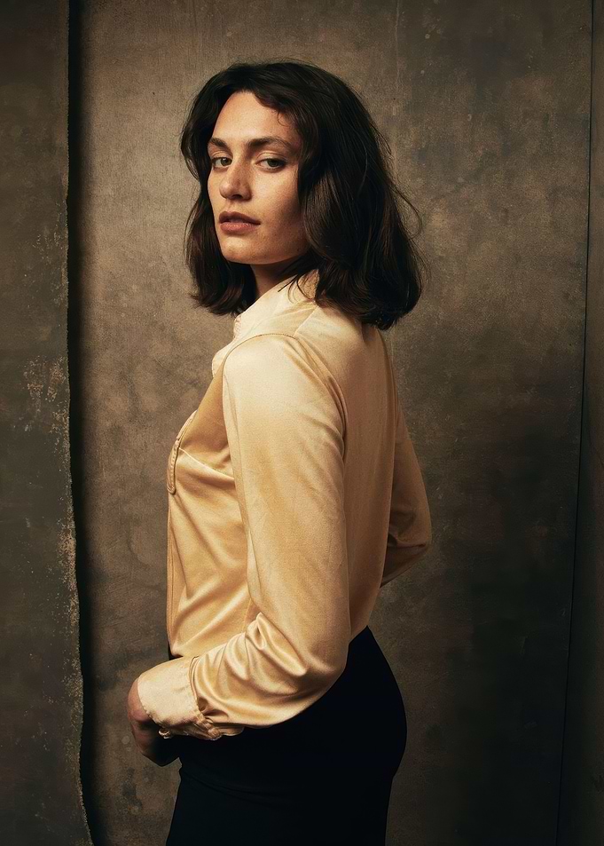 ella rumpf in satin shirt and black pants