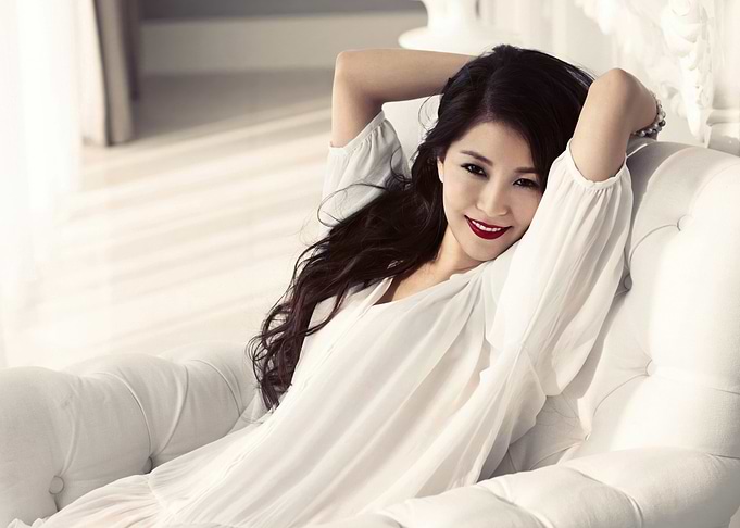 boa kwon korean in white dress on a white couch