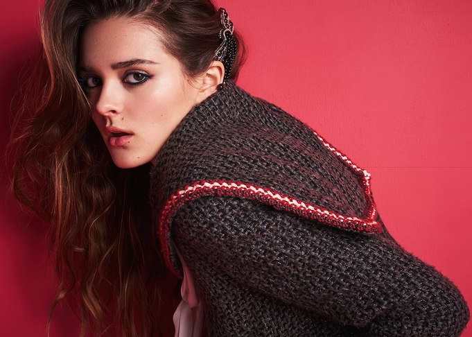 charlotte lawrence in a knitted sweater