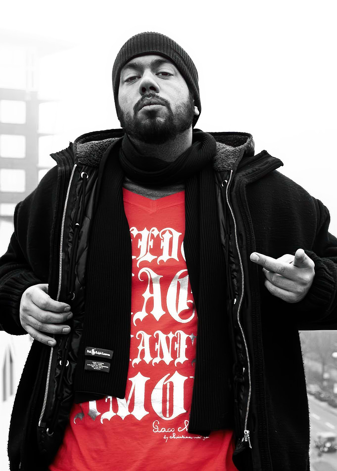 samy deluxe in Black Jacket and Red Shirt