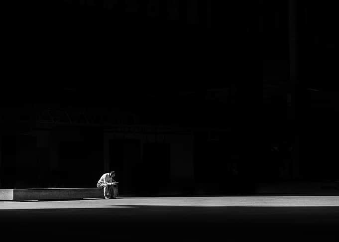 Man sitting alone in the dark