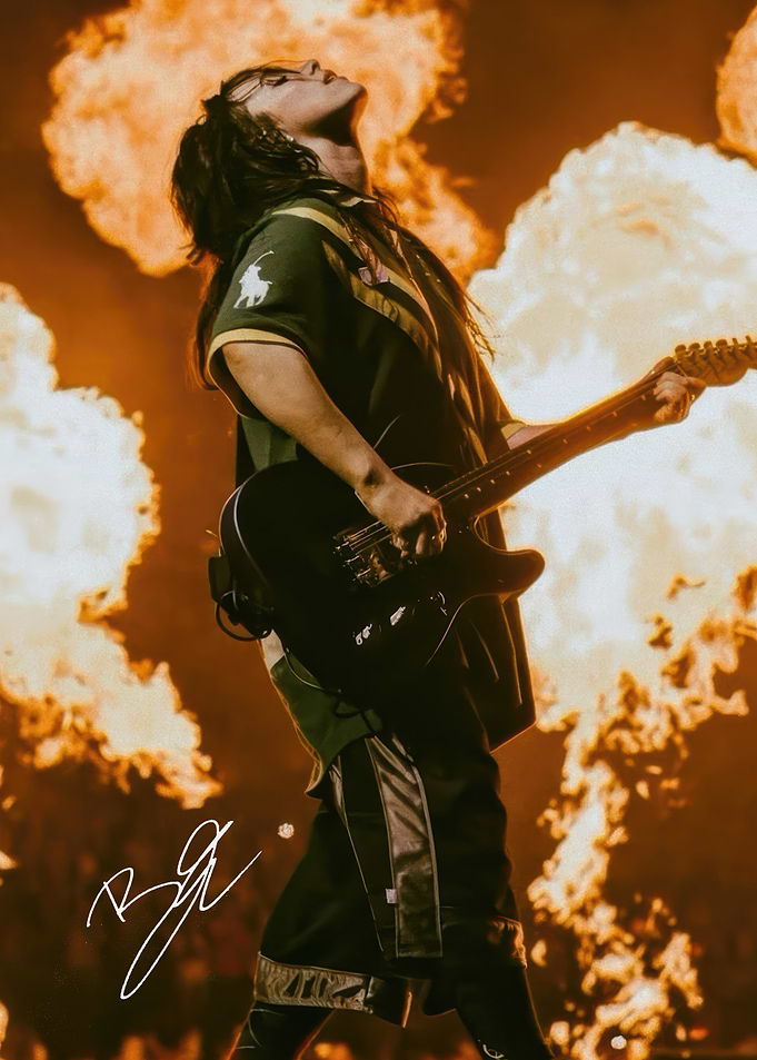 Billie Eilish Performing with Guitar and Flames