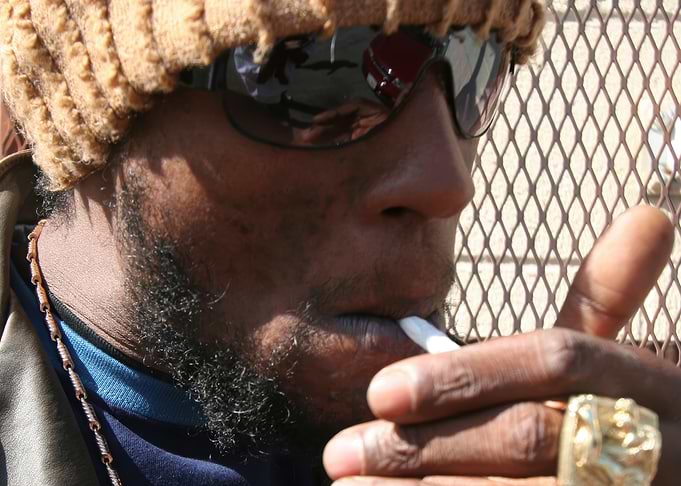 jah mason smoking with sunglasses and beanie