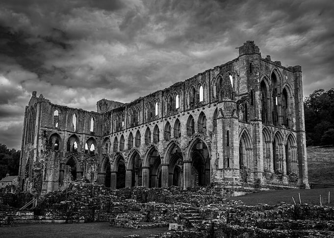 Ruined Abbey Under Dramatic Sky