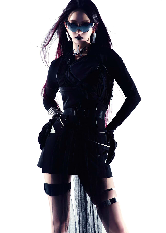 Woman in futuristic black outfit and sunglasses aespa