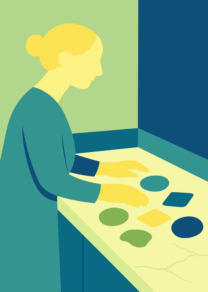 Woman interacting with shapes on a table