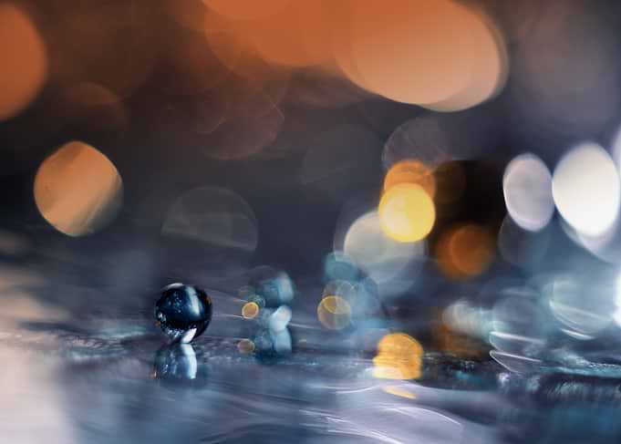 Glass ball on a reflective surface