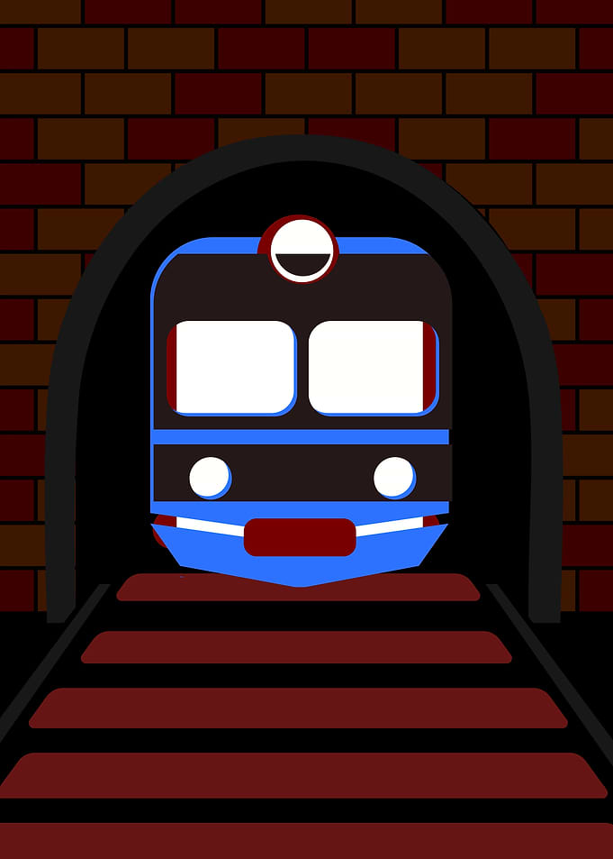 Blue train emerging from a brick tunnel