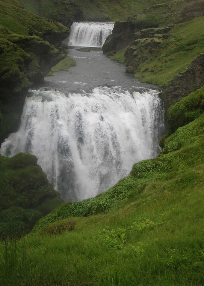 Majestic Waterfall in Lush Green Landscape