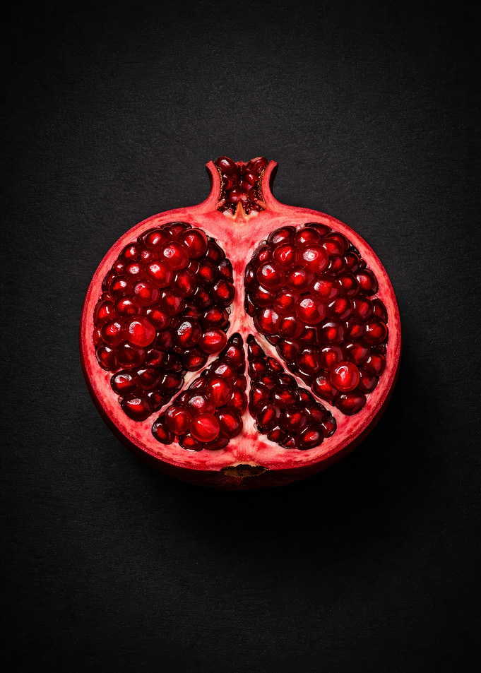 Half Pomegranate on Black Background