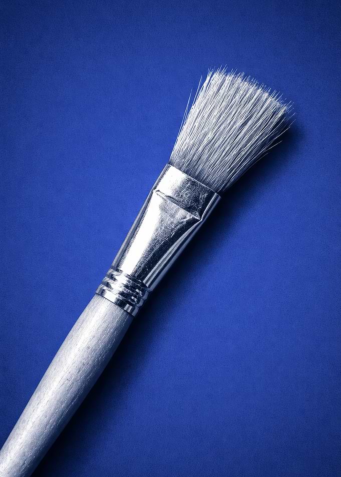 Paintbrush on a blue background