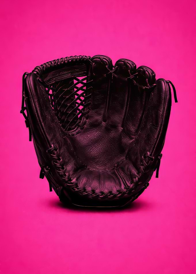 Black Baseball Glove on Pink Background