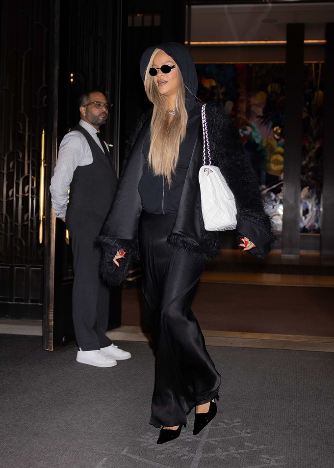 Woman in Black Outfit with White Purse