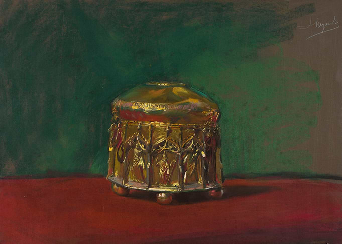 Golden ornate box on red surface