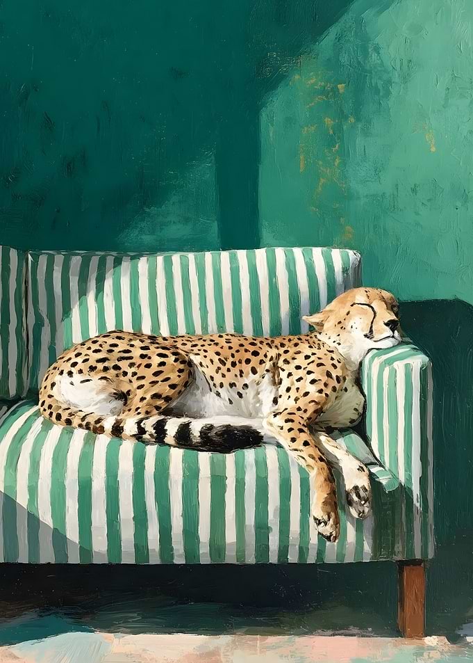 Cheetah sleeping on a striped couch