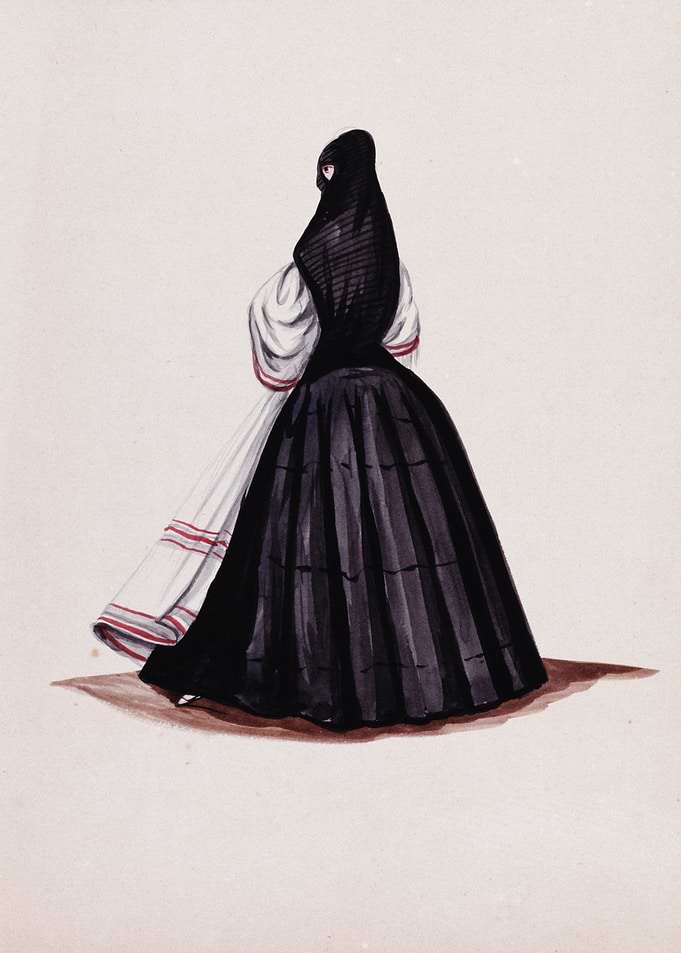 Woman in traditional black and white dress