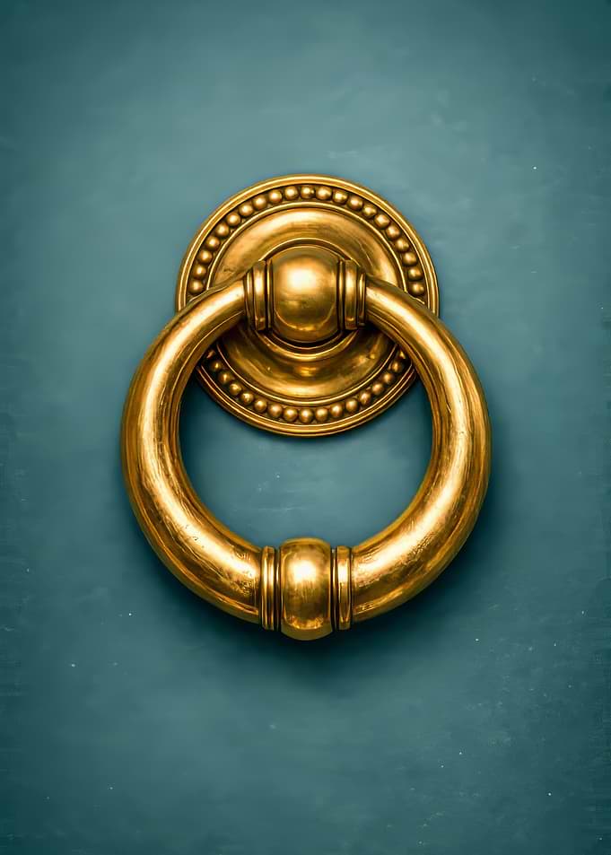 Golden Door Knocker on Teal Door