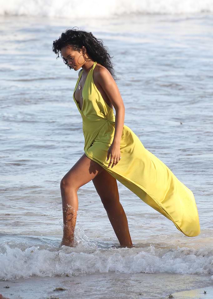 Woman in Yellow Dress on Beach