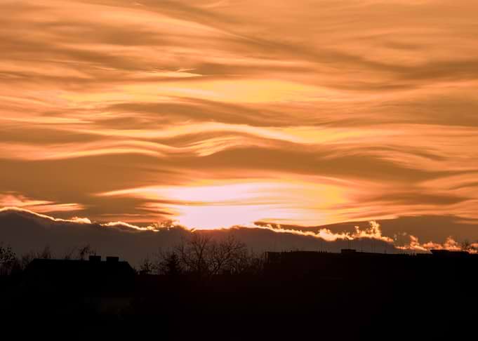 Sunset Over Silhouetted Buildings