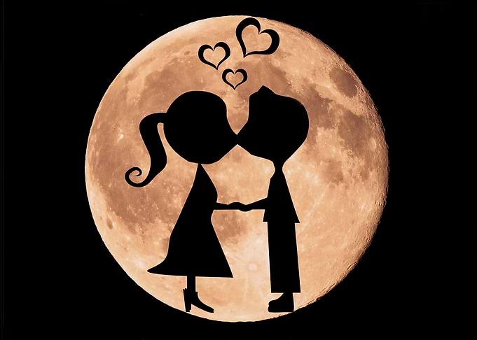 Couple kissing under the moon
