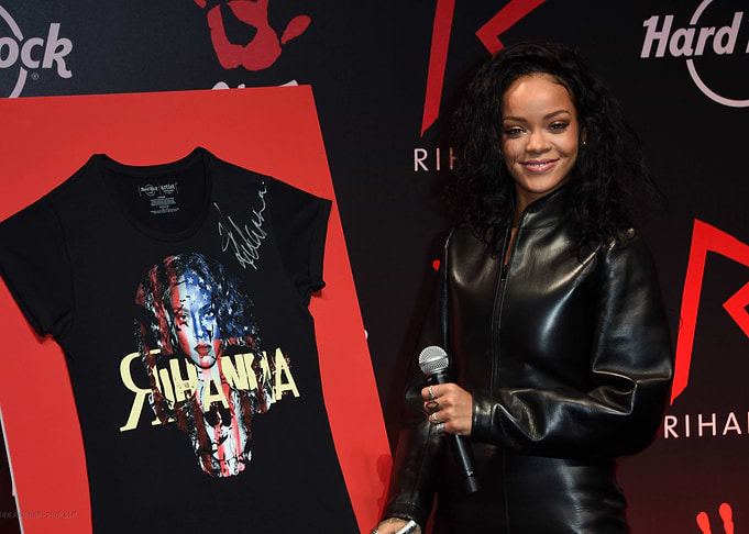 Rihanna in Leather Jacket with Signed T-Shirt