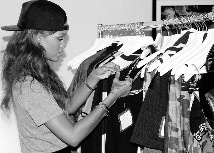 Woman in a cap shopping for clothes