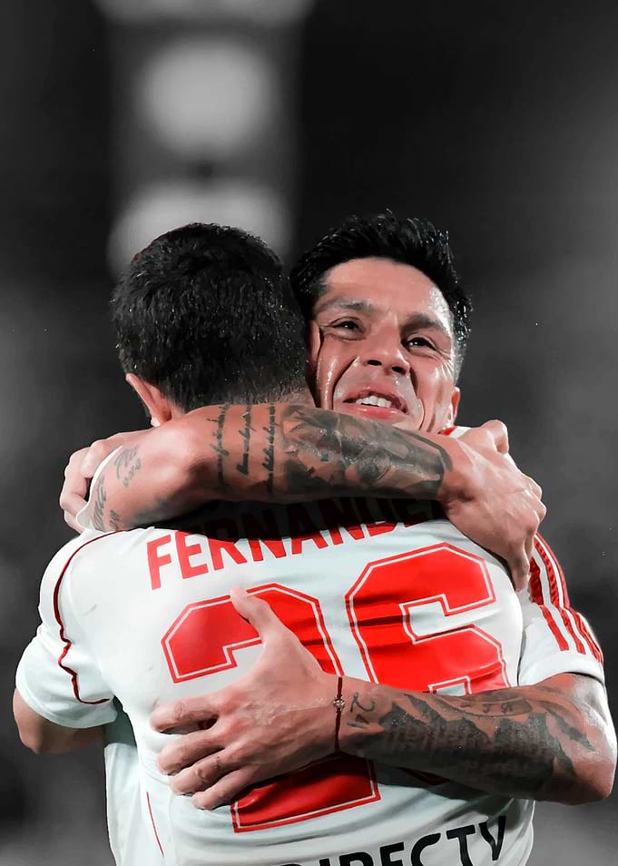 Football players celebrating a goal