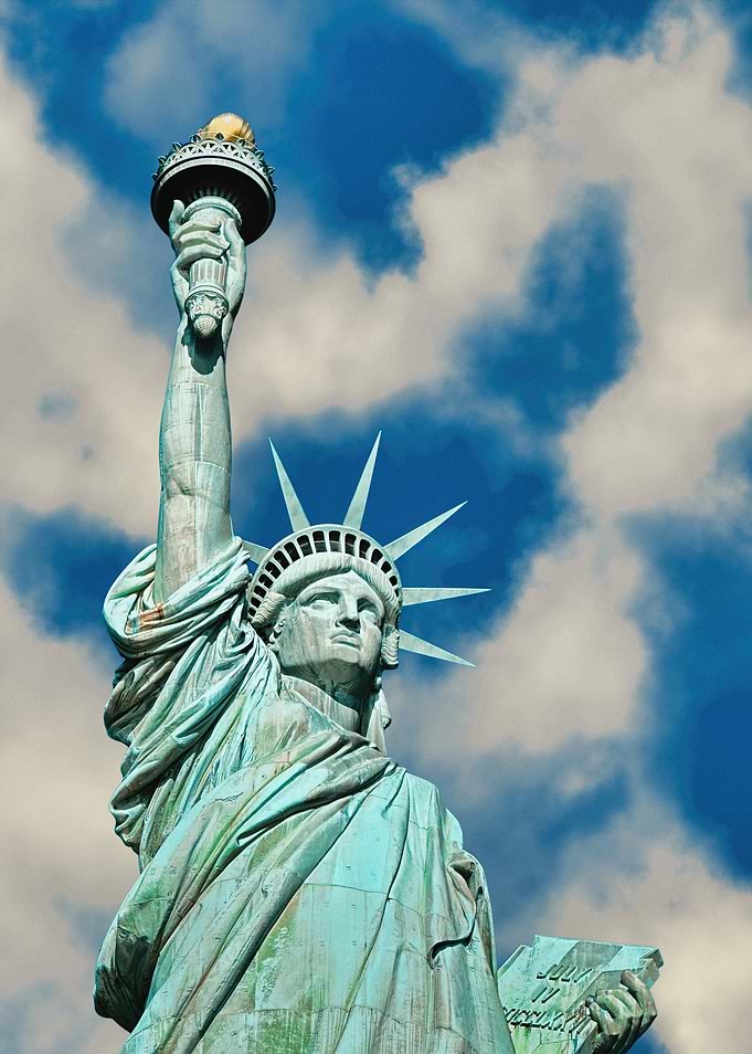Statue of Liberty against cloudy sky