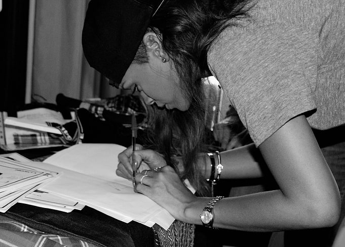 Woman writing in a notebook