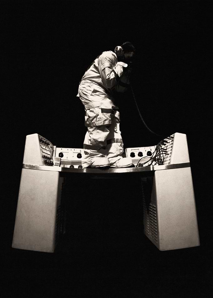 Man on vintage electronic equipment