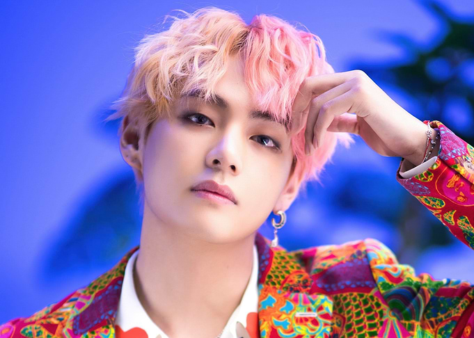 BTS V with pink hair and colorful jacket