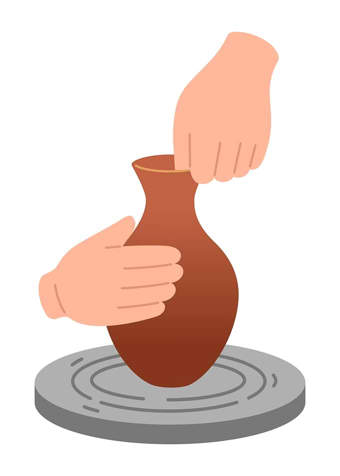 Pottery Wheel with Hands Shaping Clay