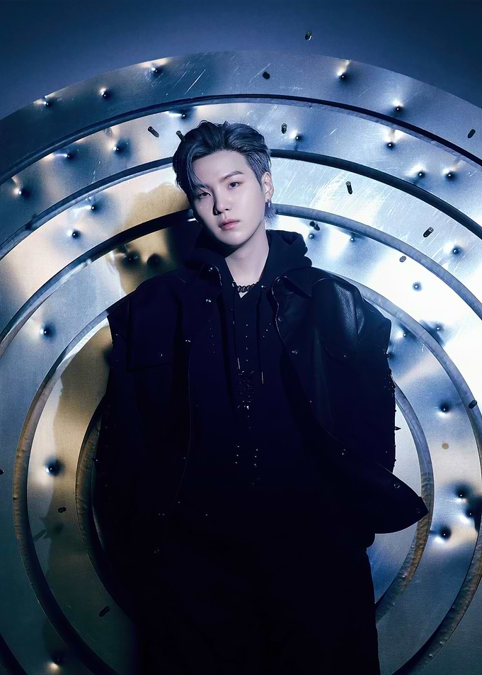 Suga of BTS in dark attire