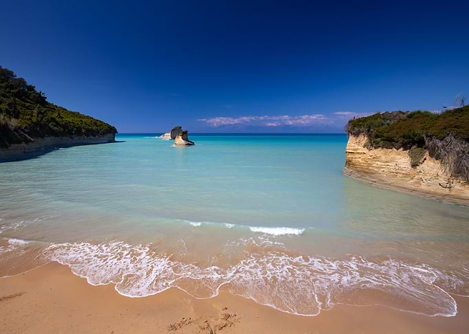 Scenic coastal cove with rock formations, Corfu