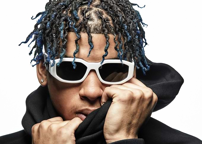 NLE Choppa Rapper with Blue Dreadlocks and White Sunglasses