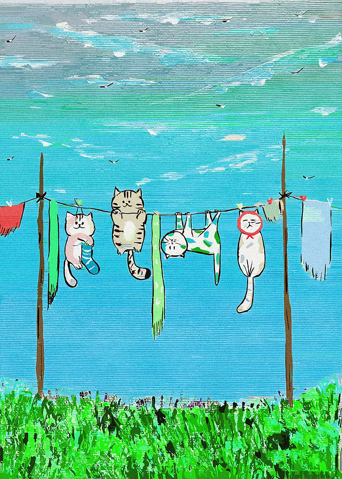 Cats hanging on a clothesline