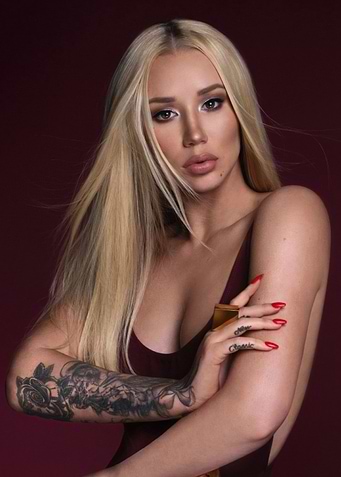 Iggy Azalea Poses in Burgundy Dress