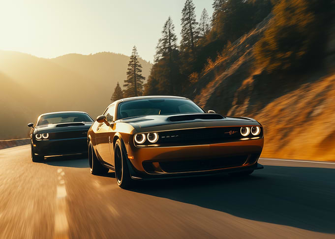 Dodge Challengers on a mountain road