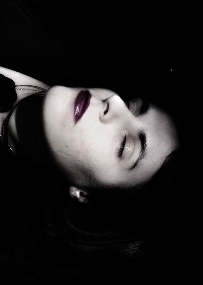Woman with Dark Lipstick in Shadow