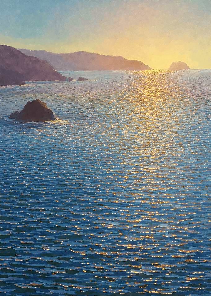 Sunset Over Ocean with Rocky Coastline