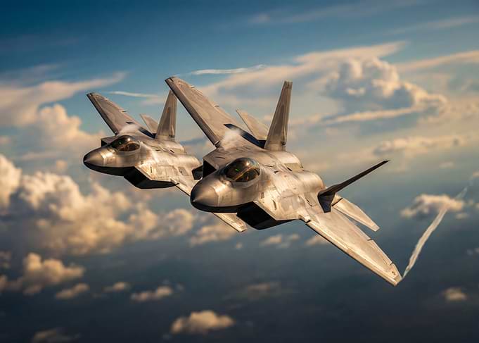 Two Fighter Jets Flying in Formation