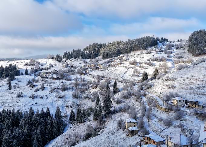 Snowy Village on a Hillside